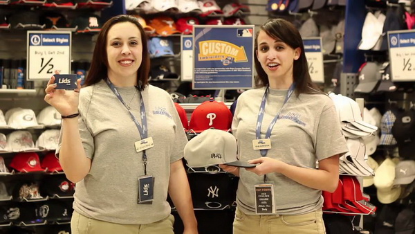 These two Lids employees are very enthusiastic about their jobs. 